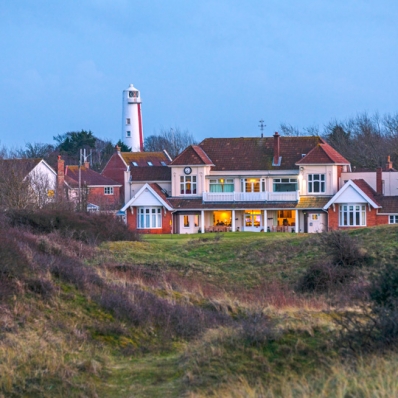 The Burnham & Berrow Golf Club clubhouse at dusk.