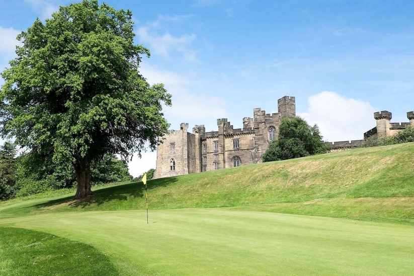 A photo of Brancepeth Castle Golf Club with Brancepeth Castle in the background.