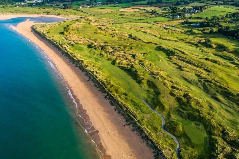 A drone photo of the beach adjacent to the links at Portsalon Golf Club in Ireland.