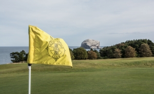 A flag blowing in the wind at Glen Golf Club East Links.