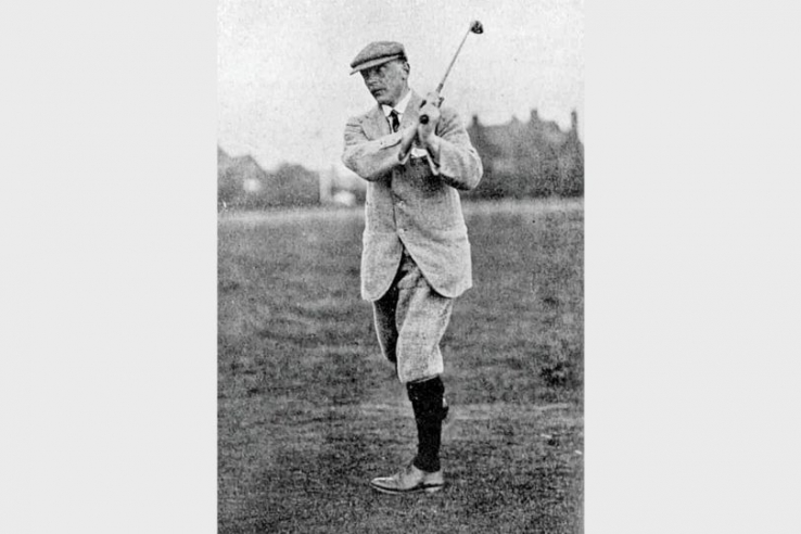 A photo of Harry Colt swinging a golf club.
