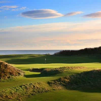 The 9th green with Irish Sea behind Royal County Down Golf Club.