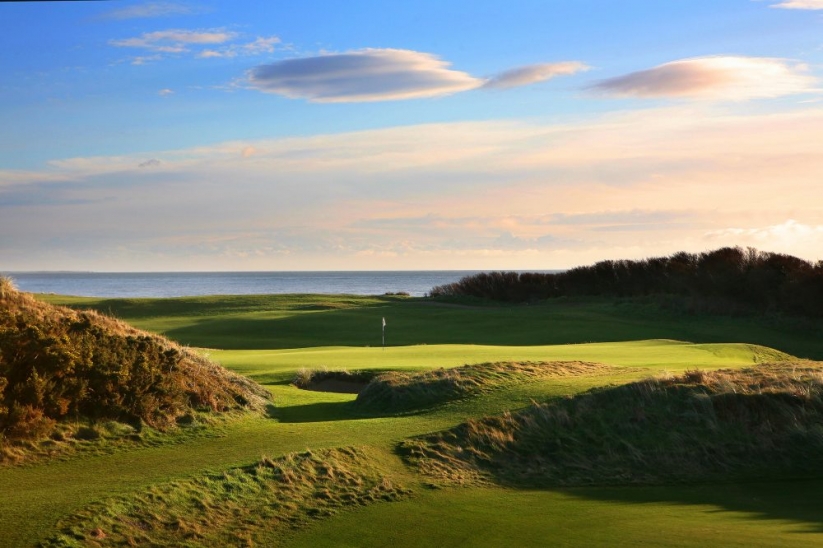 The 9th green with Irish Sea behind Royal County Down Golf Club.