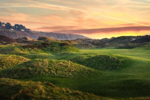 A photo at sunrise of Royal St David's Golf Club, or Harlech, in Wales.