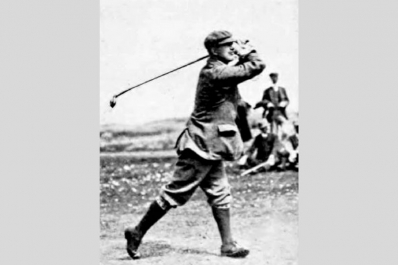 Golf Course Architect Sir Guy Campbell holding his pose after a swing.