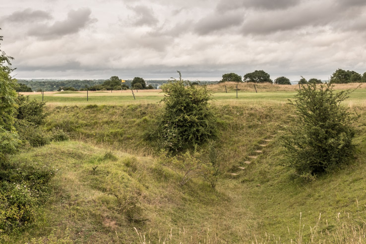 The old quarry used as a hazard at the at a bunkerless golf course. 